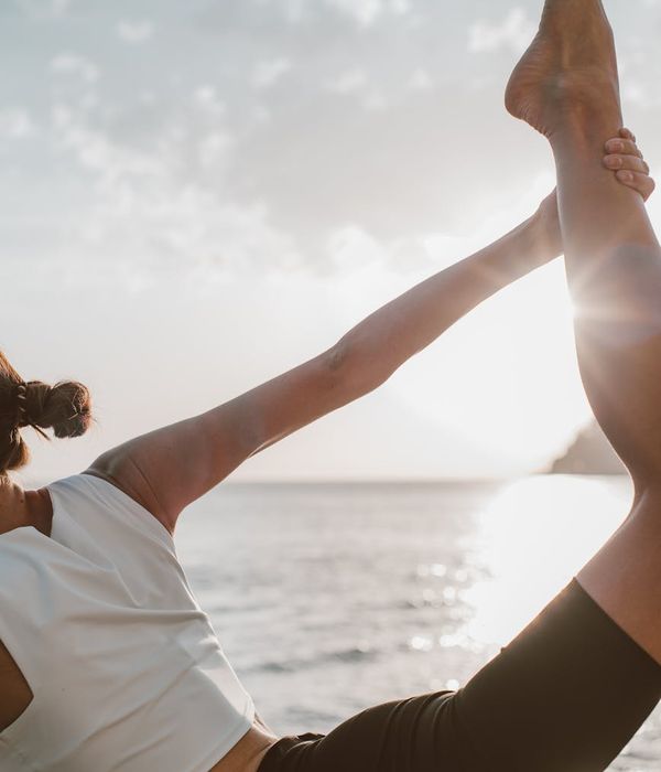 Woman in a peaceful yoga pose, embodying balance and calm.